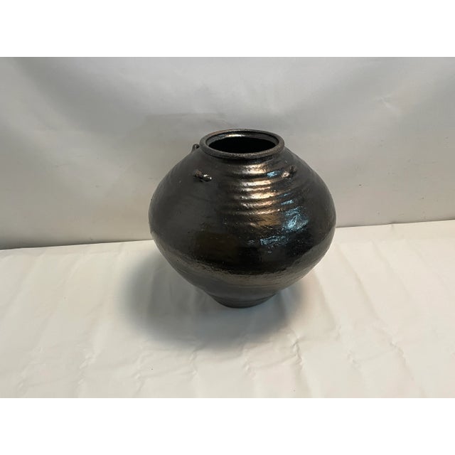 An elegant earthenware vessel with a classic look & a modern feel. Crafted by hand, this watertight vase features...