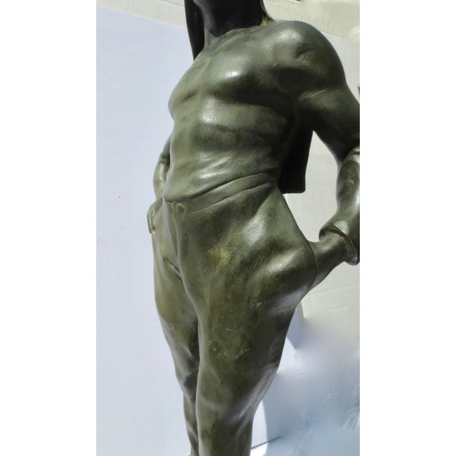 Henri Alphonse Nelson, sculpture of a Coal Porter. ( Nelson, French 1854-1919) Dark olive bronze patina. Signed on the top...