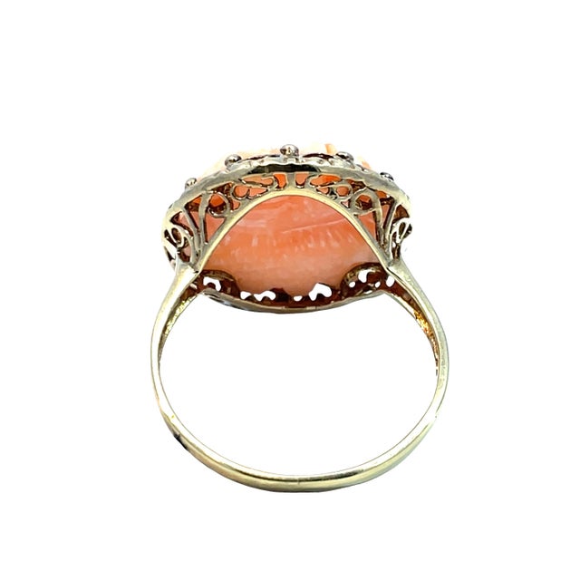 Elevate your jewelry collection with this stunning light orange coral ring, beautifully set in luxurious 14k yellow gold....