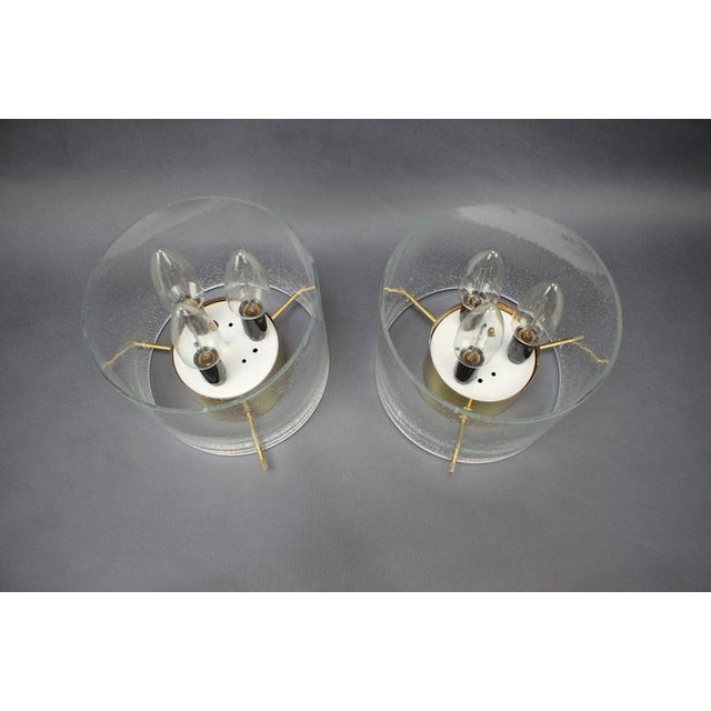 Striking pair of original german ceiling lights dating from the 1970s, combining cylindrical textured glass shades with...