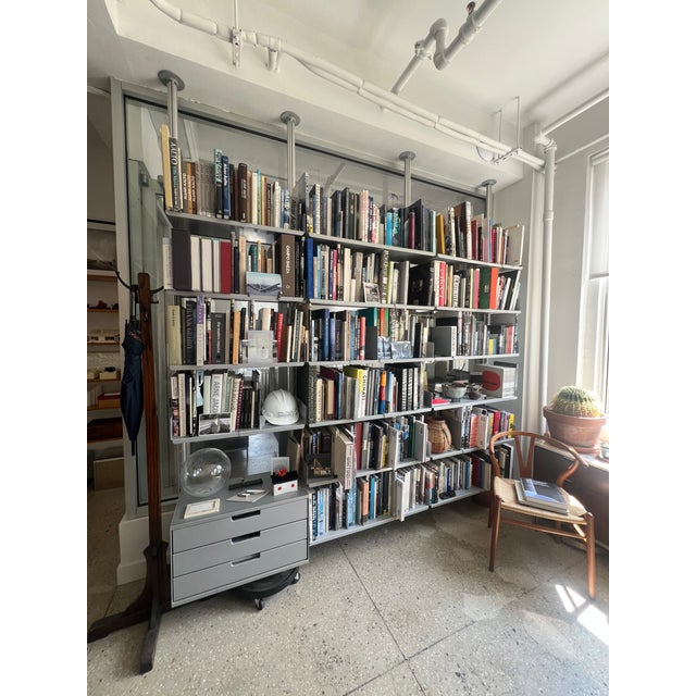 The images included are examples of how we have used the Vitsoe Shelving system in an office setting. The images do not...