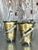 Unleash a touch of mythical drama with this striking pair of vintage brass vases or cachepots. Each piece features a warm,...