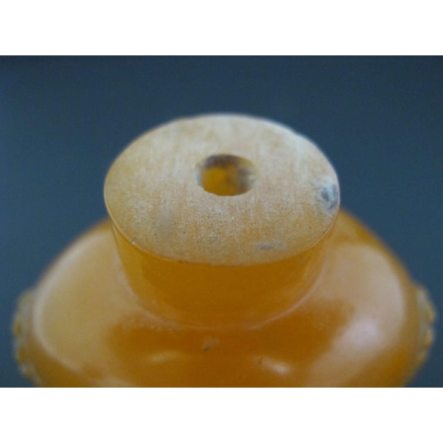 Chinese Erotic Orange Engraved Mock Mask Ring Handle Snuff Bottle For Sale - Image 9 of 11