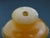 Chinese Erotic Orange Engraved Mock Mask Ring Handle Snuff Bottle For Sale - Image 9 of 11