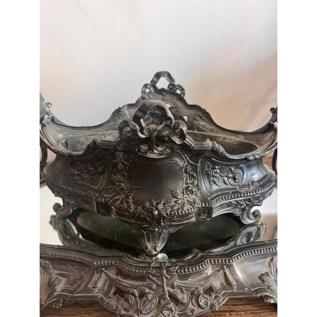 An impressive antique french table centrepiece consisting of an ornate jardinière and a large matching mirrored plateau....