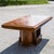 Original table Art Decò Impellied in walnut with a base covered in metal of the aforementioned manufacture that is...