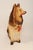Circa 1940s/50s Outsider Art painted chalkware collie dog figurine in brown and cream with red bow and mouth details...