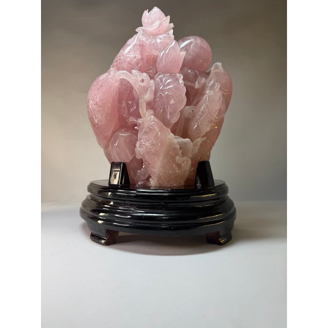 An impressive vintage Chinese rose quartz carving depicting a lively grouping of koi or carp swimming among lotus...