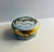 Charming Crummles & Co. enamel box depicting the Palace of Westminster on top and view of the Thames River on the edges....