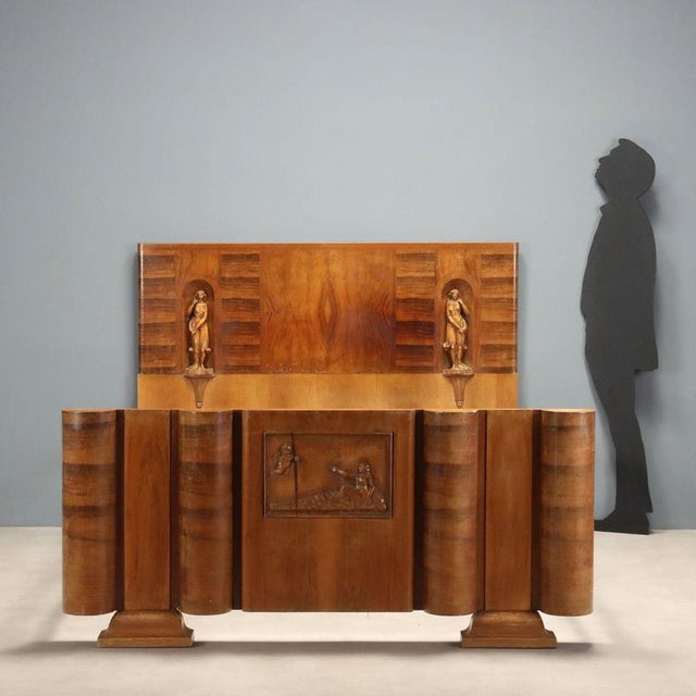 Bed in walnut veneer and walnut burl, an expression of Italian Art Deco elegance. The headboard is enriched with...