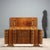 Bed in walnut veneer and walnut burl, an expression of Italian Art Deco elegance. The headboard is enriched with...
