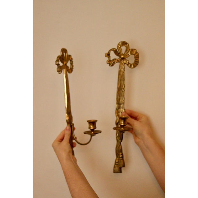 An amazing pair of Mid century brass wall sconces, suitable for use with standard dinner candle. Both sconces are in good...