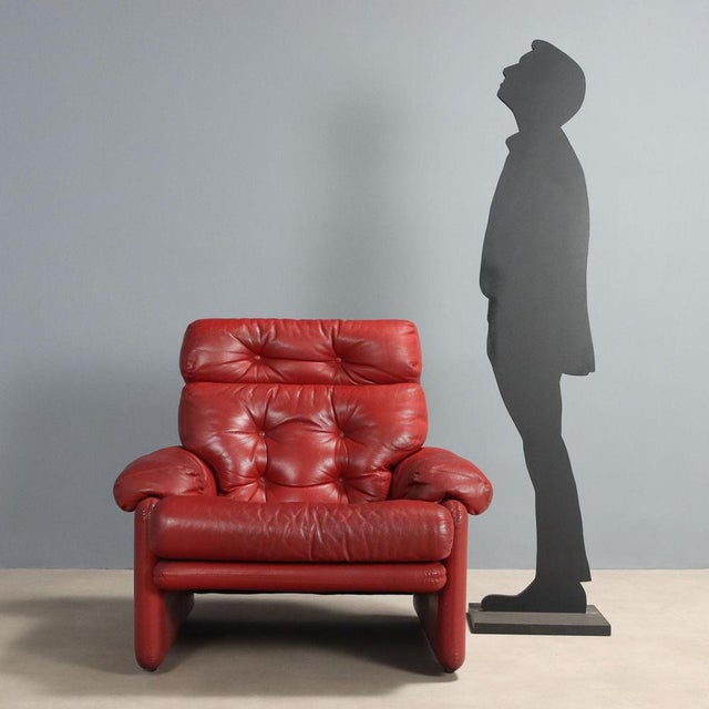 Armchair with foam padding, leather upholstery. This piece is attributed to the mentioned designer/maker. It has no...