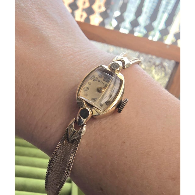 This vintage Bulova ladies cocktail watch reflects the refined styling of the 1950s. The rectangular tonneau-shaped case...