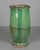 A large 19th century green glazed terracotta pottery olive oil jar from the Southwest of France. Minor losses to glaze and...