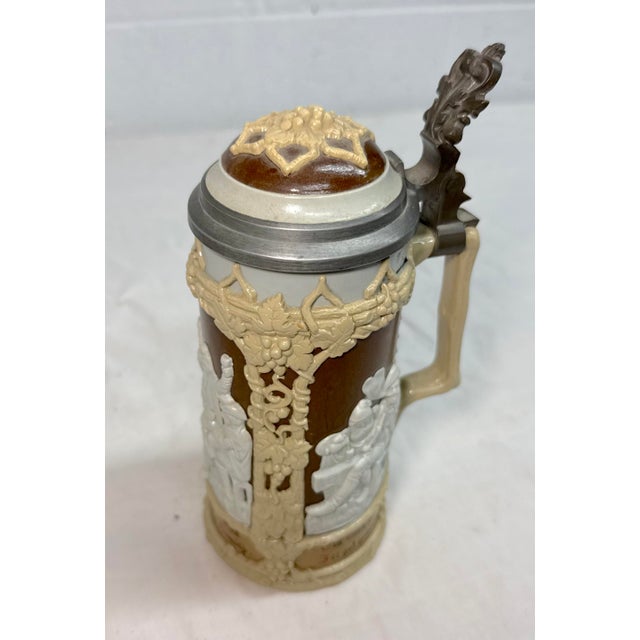 Up for sale is a high quality antique pewter lidded Mettlach, German pottery beer stein made in the 19th century by...