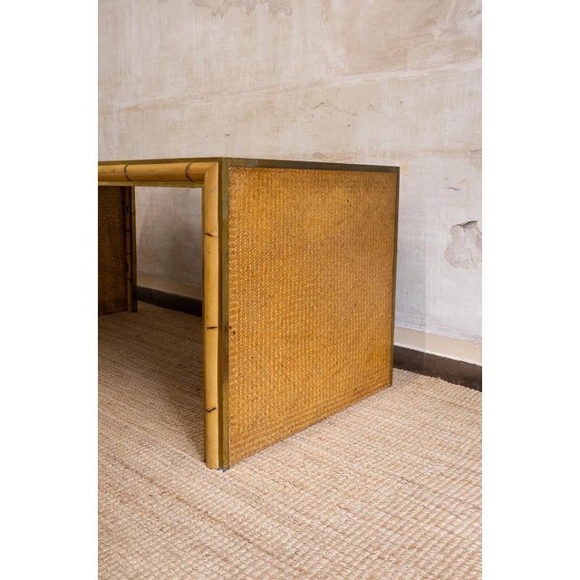 1970s desk featuring a bamboo structure with surfaces covered in woven rush. The top and side panels are finished with...