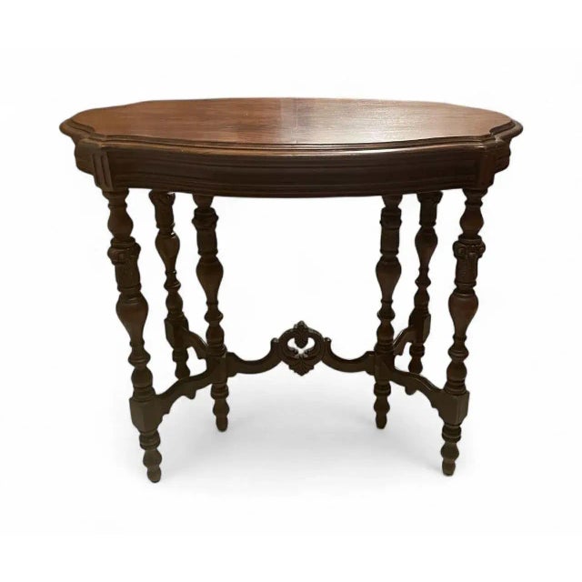 Gorgeous heavy parlor table. Stylish hand turned/carved legs. Date range is late 1800's to early 1900's. A repair has been...