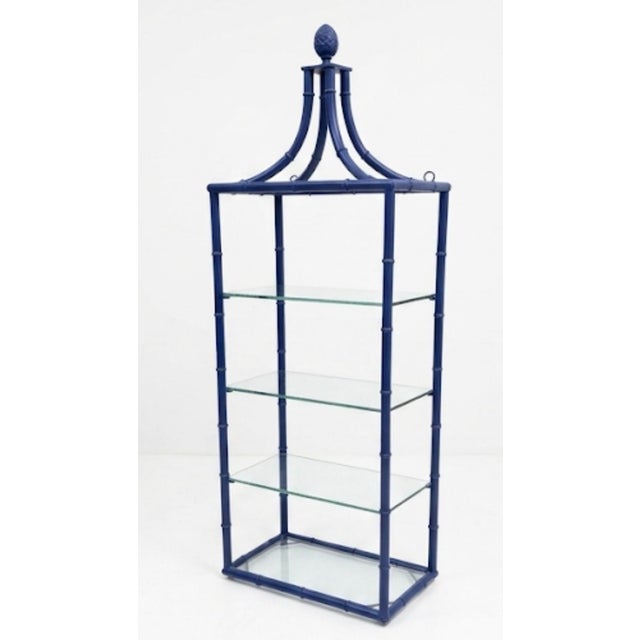 Infuse your interior with vibrant color and classic coastal style with this striking faux bamboo etagere. Masterfully...