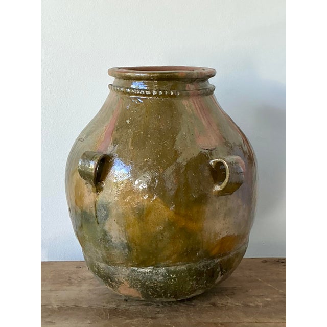 This monumental vintage ceramic urn is a masterclass in organic form and textural depth. Featuring a generous, bulbous...