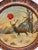 This painted target features a winter stag scene and bullet holes/impacts along with traditional hand-painted script in...