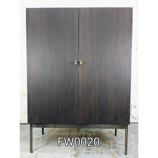 Custom built high end media cabinet. Solid walnut, stained a deep plum, with patinated steel base. 4 interior solid...