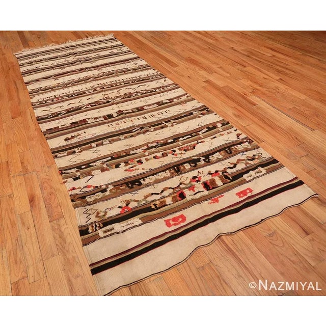 This sublime vintage Moroccan rug is a textural work of art with dramatic knotted pile accents skillfully intertwined in a...