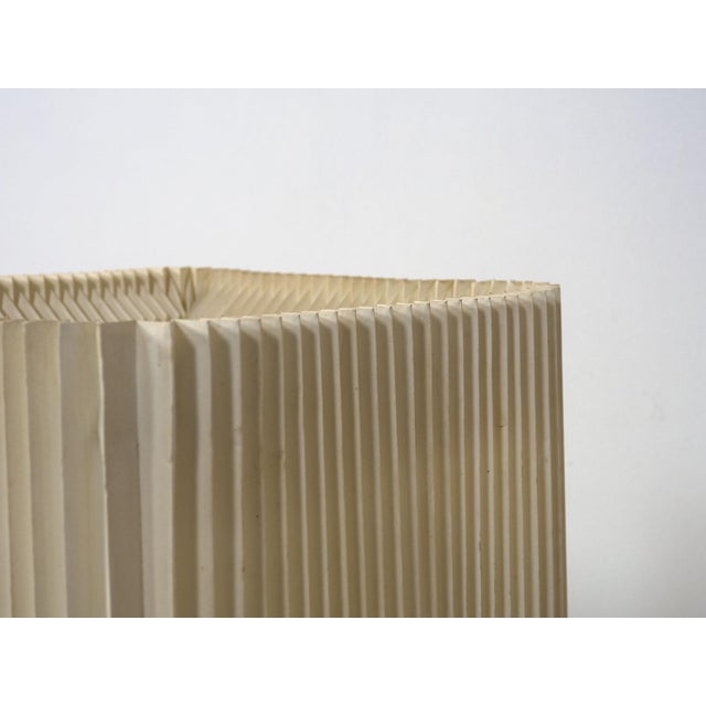 Very rare and large floor lamp made by Le Klint in the 1960s. This lamp has a ceramic square lamp body with a fat lava...