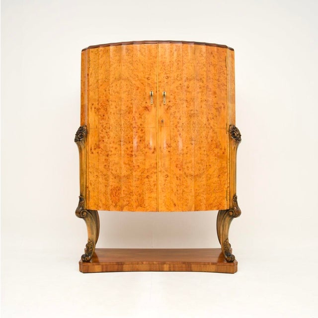 A magnificent Art Deco burr walnut cocktail cabinet by Epstein. This was made in England, it dates from the 1920’s. It is...