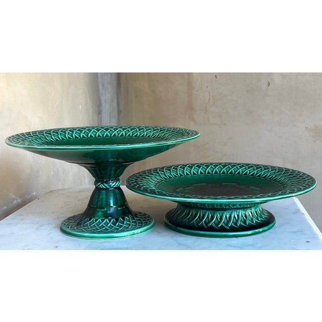 Hand painted vibrant green majolica footed compote made in England by Minton, date stamped to 1860. The plate has a...