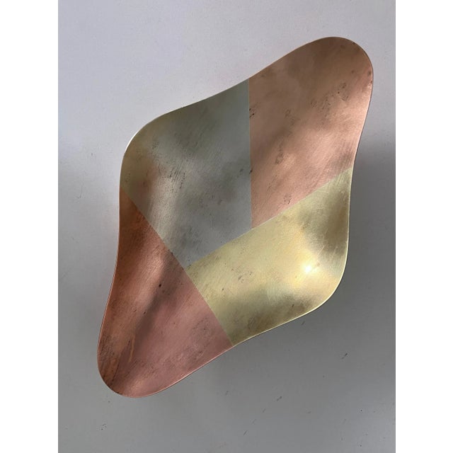 Multi-metal kaleidoscopic tray with charming patina. A gorgeous freeform shape with a slight concavity to draw its...