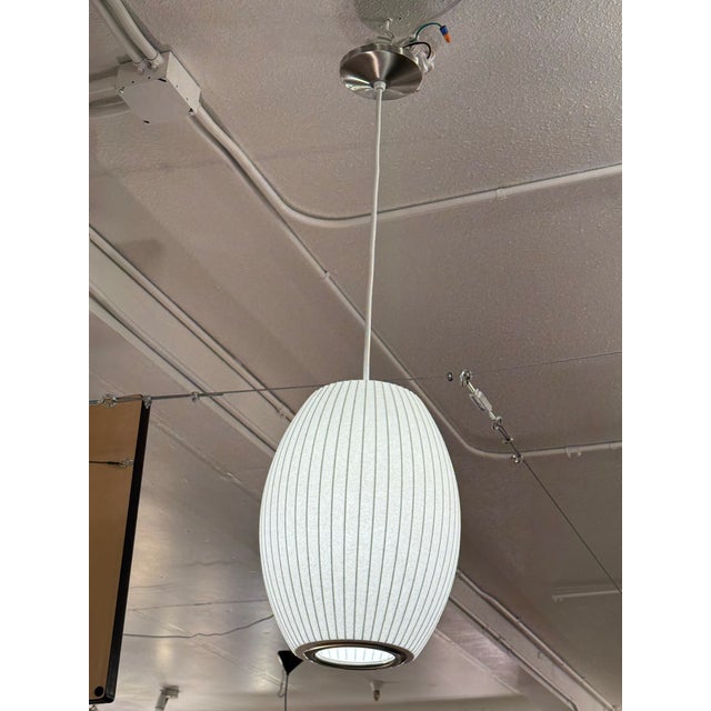 Design Plus Gallery presents a Nelson Cigar Bubble Pendant by George Nelson for Herman Miller. This pendant has an oval...