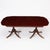 Elegant English George III style double-pedestal dining table, made in the early to mid-20th century and crafted in richly...