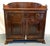 Timeless dry sink cabinet from the mid 20th century. It is made of mahogany with a lower double door cabinet with a...