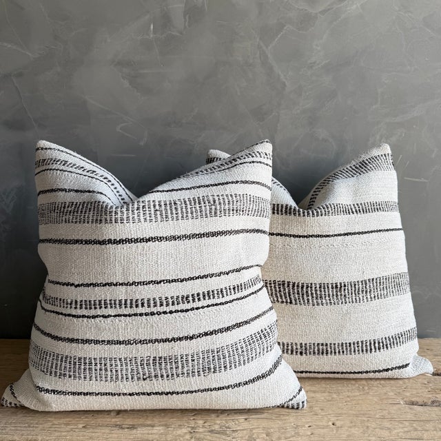 Creamy white hemp rug pillow with stripes. Soft hand, linen blend backing with zipper closure. Spot cleaning is...