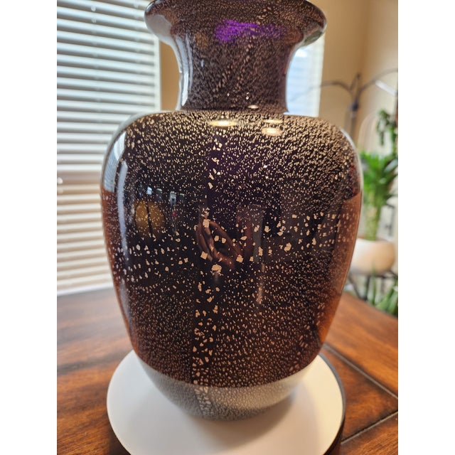 An exceptional example of mid-century Italian mastery, this monumental Murano art glass vase is attributed to the...