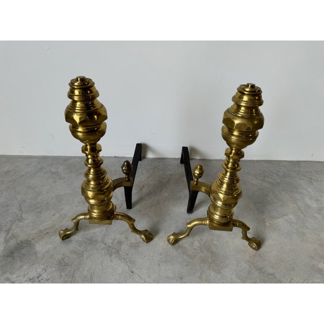 Pair of beautiful Vintage American brass and iron andirons, spurs and log stops on ball and claw feet. Measures: 14.0" w x...