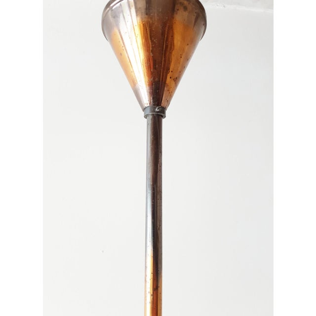 Good condition, a piece of glass has been reattached, invisible when the glass cylinder is in place. Some oxidation....