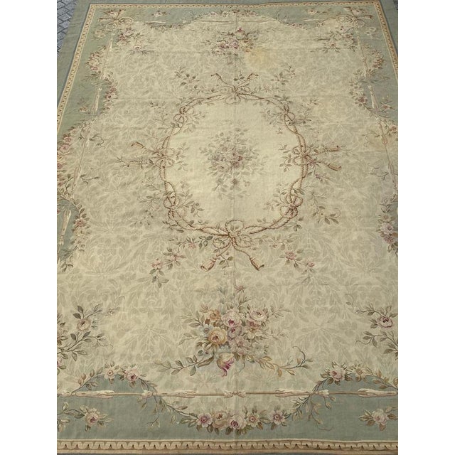 Exquisite large Antique French Aubusson rug from the early 20th century, meticulously handwoven in wool on Aubusson looms....