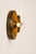 Pair of disc-shaped wall sconces in patinated brass, made in Italy in the 1970s. Timeless design for this classic in this...