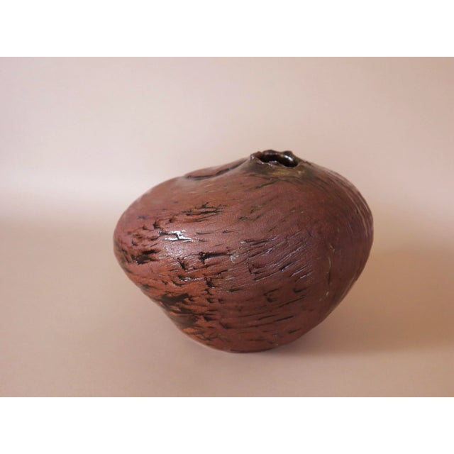 Signed mid century studio ceramic pottery vessel handmade in California. Various swirling smooth and rough textures in...