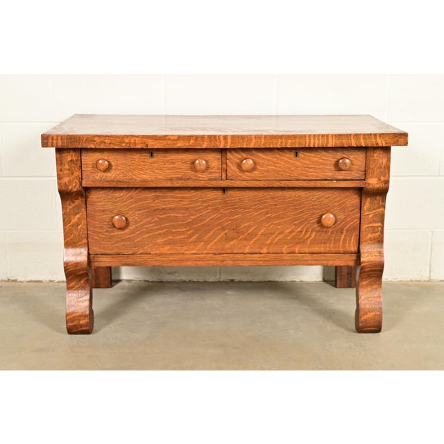 A gorgeous antique Victorian or American Empire period quarter sawn tiger oak lowboy dresser or chest of drawers In the...