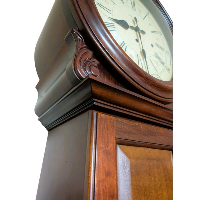 The Howard Miller La Rochelle Grandfather Clock is a timeless piece crafted from Americana Cherry wood with a warm,...
