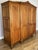 A beautifully presented Vintage French Louis wardrobe , featuring an elegant four-door design with a warm oak finish,...