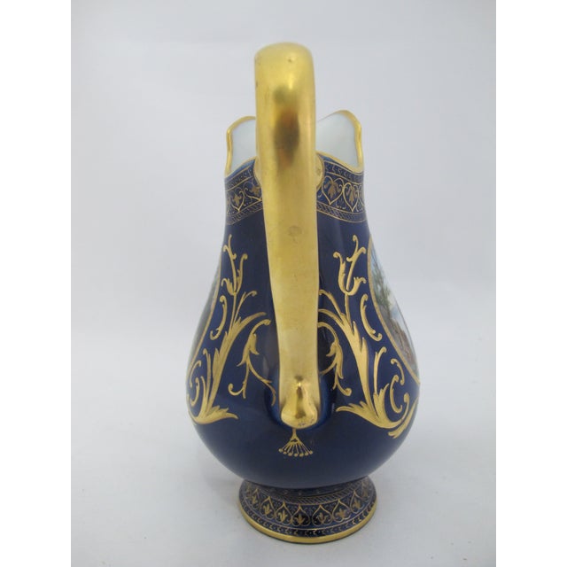 19th century, Hans Heiling Karlsbad Hermann Voigt, Bohemia porcelain pitcher. Cobalt blue with ornate gilt accents and...