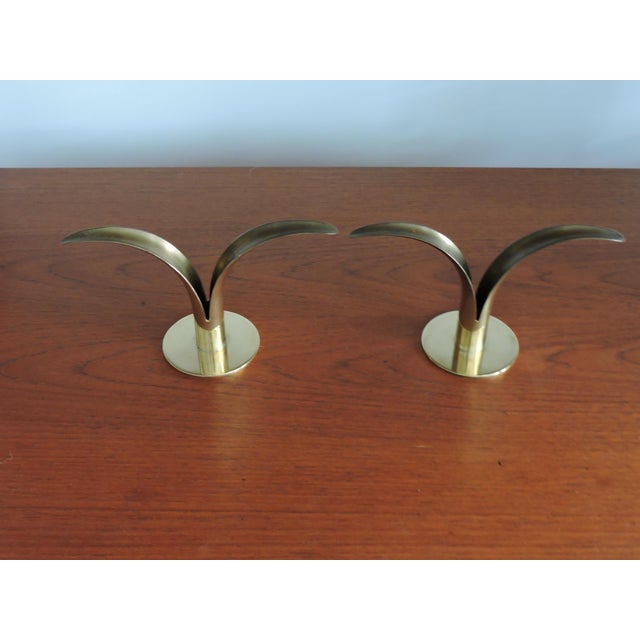 Beautiful and elegant pair of Liljan solid brass candle holders designed by Swedish sculptor and designer, Ivar Alenius...