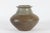 Large wide vase with sweeping shape, made of chamotte clay which gives the surface an rustic expression. The glaze is...