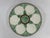 A charming French Faience Longchamp glazed majolica oyster plate with a lighter green basket weave background trimmed with...