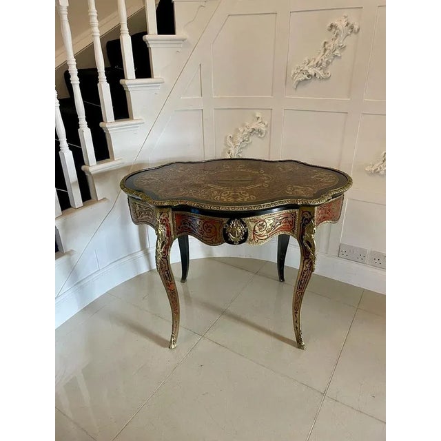 Antique French Boulle Centre Table having a fabulous serpentine shaped top featuring all over tortoise shell and profuse...