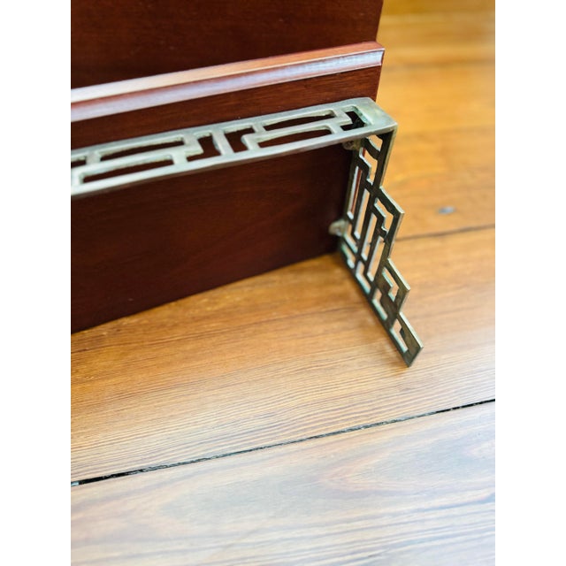 A vintage chinoiserie pair! A vintage pair of brass and wood wall shelves. The Greek key is such a great look! There is...
